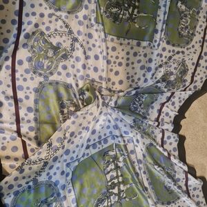 Silk scarf, very trendy featuring horses.  Could be a very nice accent piece.
